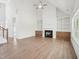 Living room with fireplace, white built-in shelves, and high ceilings at 38 Hewitt Woods Dr, Clayton, NC 27527