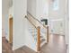 Open concept view from staircase with wood and white trim at 38 Hewitt Woods Dr, Clayton, NC 27527