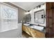 Modern bathroom with double vanity, large mirror, and white subway tile at 4224 Sancroft Dr, Apex, NC 27539