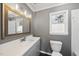 Bathroom with vanity, mirror, and toilet at 4224 Sancroft Dr, Apex, NC 27539