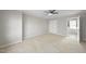 Spacious bedroom with carpet, ceiling fan, and double doors to closet at 4224 Sancroft Dr, Apex, NC 27539