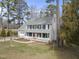 Two-story house with gray siding, white porch, and attached garage at 4224 Sancroft Dr, Apex, NC 27539