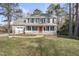 Two-story house with gray siding, red door, and attached garage at 4224 Sancroft Dr, Apex, NC 27539