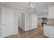Updated kitchen offers stainless steel appliances, white cabinets, and wood flooring at 4224 Sancroft Dr, Apex, NC 27539