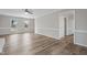Inviting living room boasts wood floors and large windows with ample natural light at 4224 Sancroft Dr, Apex, NC 27539