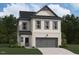 Two-story house with gray and beige siding, two-car garage, and landscaping at 4420 Darius Lane # 37, Fuquay Varina, NC 27526