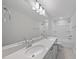Bathroom featuring double sinks, large mirror, and a shower-tub combination at 45 Nimble Way # 180, Clayton, NC 27520