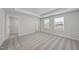 Spacious main bedroom featuring tray ceilings, carpet floors, and a walk-in closet at 45 Nimble Way # 180, Clayton, NC 27520