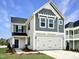 Charming two-story home with a two car garage, manicured lawn, and welcoming front entrance at 45 Nimble Way # 180, Clayton, NC 27520