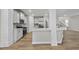 Well-equipped kitchen with stainless appliances, white cabinets, and an island with counter seating at 45 Nimble Way # 180, Clayton, NC 27520