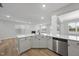 Bright kitchen island with a sink and dishwasher, and an open layout to the living room with a fireplace at 45 Nimble Way # 180, Clayton, NC 27520