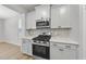 Gourmet kitchen features stainless steel appliances, granite countertops, and modern cabinetry at 45 Nimble Way # 180, Clayton, NC 27520