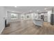 Spacious living room featuring hardwood floors, a fireplace, and ample natural light from large windows at 45 Nimble Way # 180, Clayton, NC 27520