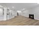 Open-concept living room with hardwood floors, fireplace, breakfast bar, and stairs to the second level at 45 Nimble Way # 180, Clayton, NC 27520