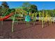 A colorful and engaging playground with a variety of climbing structures and a slide at 45 Nimble Way # 180, Clayton, NC 27520