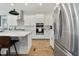 Modern kitchen with white cabinets, island, and stainless steel appliances at 512 Adkins Ridge Rd, Rolesville, NC 27571