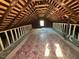 Unfinished attic space ready for conversion; features high ceilings and window at 530 W King St, Hillsborough, NC 27278