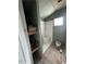 Bathroom with tiling halfway done, walk-in shower, and open shelving at 614 Tucker St, Burlington, NC 27215