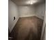 Bedroom ready for remodeling with neutral walls, carpet, closet, window, and ample natural light for new design at 614 Tucker St, Burlington, NC 27215
