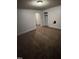 Basic bedroom, ready for renovation with neutral walls, carpet, a closet, and an open doorway at 614 Tucker St, Burlington, NC 27215