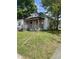 Classic single-story home with a front porch, showcasing its traditional architectural design and lawn at 614 Tucker St, Burlington, NC 27215