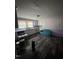 Kitchen featuring white cabinetry and trim, hard surface floors, and natural light at 614 Tucker St, Burlington, NC 27215