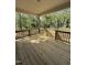 Relaxing wooden deck overlooking a lush, wooded backyard at 65 Watermelon Dr, Franklinton, NC 27525
