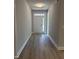Inviting hallway features light grey walls and wood-look flooring at 65 Watermelon Dr, Franklinton, NC 27525