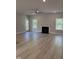 Spacious living room with fireplace, ample natural light, and neutral colors at 65 Watermelon Dr, Franklinton, NC 27525