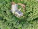 Aerial view of house and surrounding trees at 6729 Greywalls Ln, Raleigh, NC 27614
