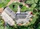 Aerial view of a home showcasing its layout, landscaping, and large driveway at 6729 Greywalls Ln, Raleigh, NC 27614