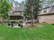 Spacious backyard with firepit, patio, and screened porch at 6729 Greywalls Ln, Raleigh, NC 27614