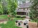 Large backyard with firepit and screened porch at 6729 Greywalls Ln, Raleigh, NC 27614