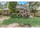 Landscaped backyard with firepit and patio at 6729 Greywalls Ln, Raleigh, NC 27614