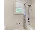 Bathroom with shower/tub combo and window at 6729 Greywalls Ln, Raleigh, NC 27614