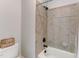 Clean bathroom with shower/tub combo and tile surround at 6729 Greywalls Ln, Raleigh, NC 27614