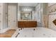 Elegant bathroom with soaking tub, double vanity, and tile flooring at 6729 Greywalls Ln, Raleigh, NC 27614