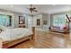 Main bedroom with hardwood floors and sitting area at 6729 Greywalls Ln, Raleigh, NC 27614