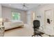 Well-lit bedroom with a twin bed and desk area at 6729 Greywalls Ln, Raleigh, NC 27614