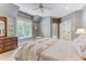 Bright bedroom with a queen bed and window seat at 6729 Greywalls Ln, Raleigh, NC 27614