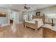 Spacious bedroom with hardwood floors and an ensuite office at 6729 Greywalls Ln, Raleigh, NC 27614