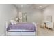 Small bedroom with a twin bed and built in drawers at 6729 Greywalls Ln, Raleigh, NC 27614