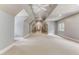 Spacious bonus room with high ceilings and carpet flooring at 6729 Greywalls Ln, Raleigh, NC 27614