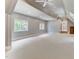 Bonus room with high ceilings, carpet, and multiple windows at 6729 Greywalls Ln, Raleigh, NC 27614