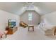 Bright bonus room with a comfy seating area and large TV at 6729 Greywalls Ln, Raleigh, NC 27614