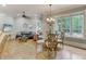 Casual breakfast nook with glass table and hardwood floors at 6729 Greywalls Ln, Raleigh, NC 27614