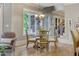 Breakfast nook with glass top table and four chairs at 6729 Greywalls Ln, Raleigh, NC 27614