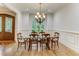 Bright dining room with chandelier and hardwood floors at 6729 Greywalls Ln, Raleigh, NC 27614