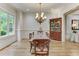 Elegant dining room with chandelier and hardwood floors at 6729 Greywalls Ln, Raleigh, NC 27614