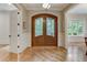 Elegant entryway with hardwood floors and double doors at 6729 Greywalls Ln, Raleigh, NC 27614